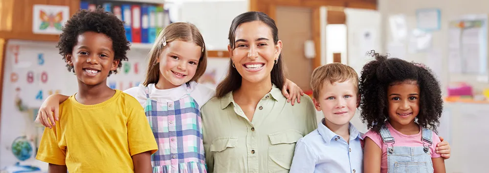 Teacher and students smiling.