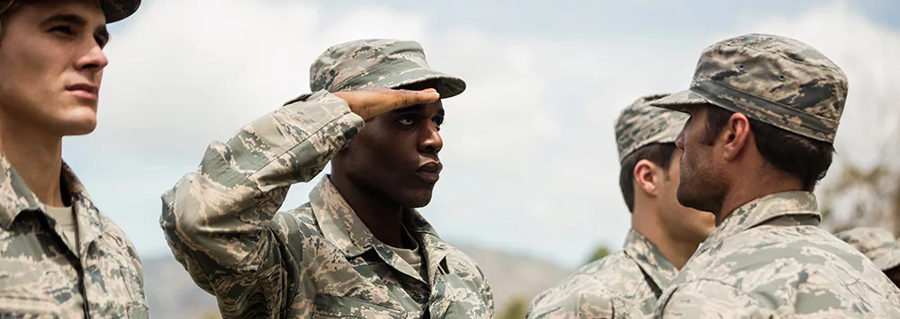Military soldier saluting superior officer.